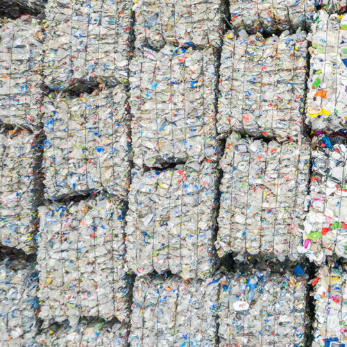 Aerial View of Squeezed Plastic Material Recovered in a Sorting Plant Awaiting Transport to Processing Facility. Waste Recycling Theme.